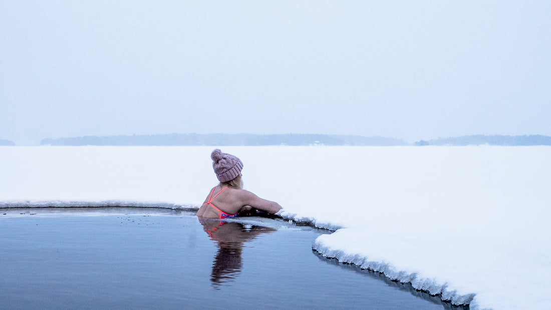 Woman swimming in ice water