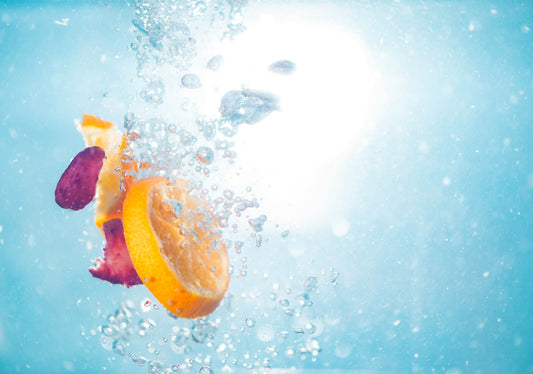 Vitamin C and the immune system represented by fruit in water