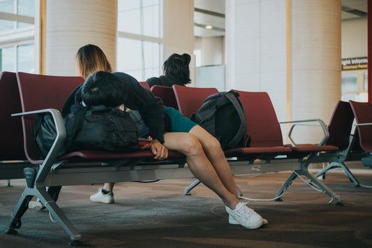 Person falling asleep in airport