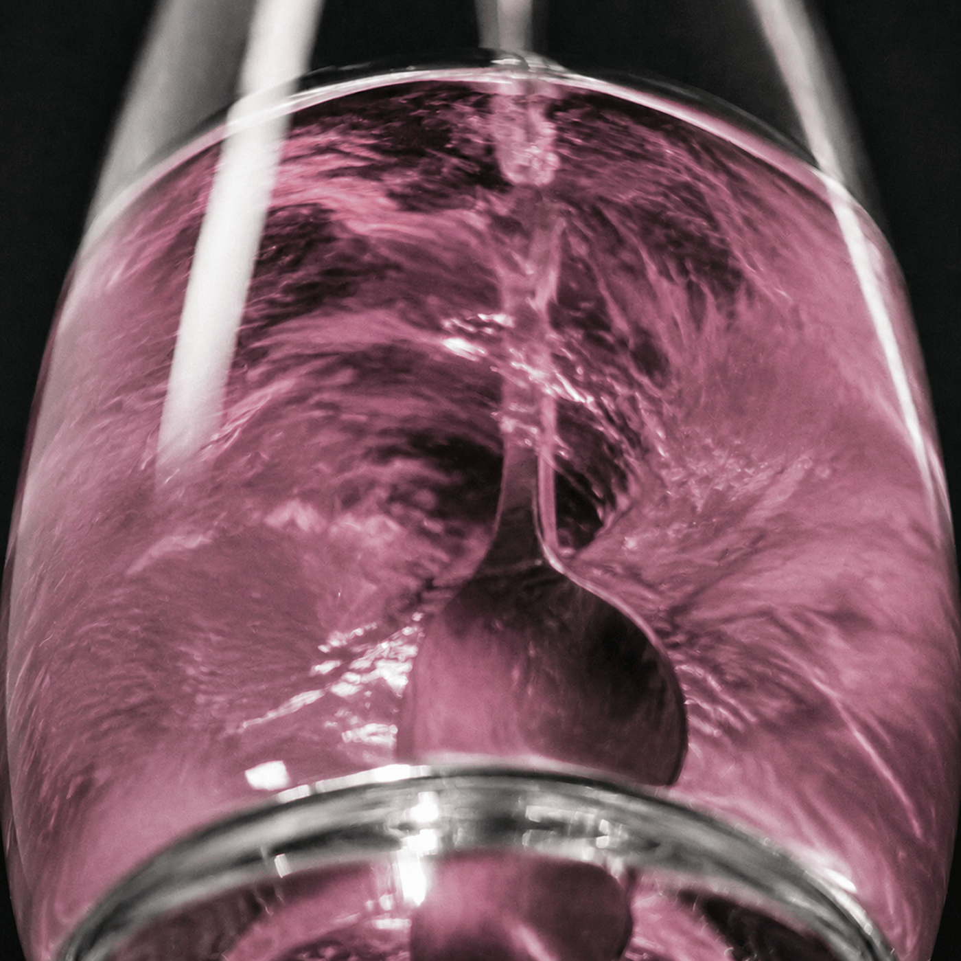 A close-up artistic shot of creatine + brain being mixed with a spoon and a dark background.