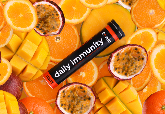 Tonic Health Daily Immunity on a bed of Orange, Mango and Passionfruit